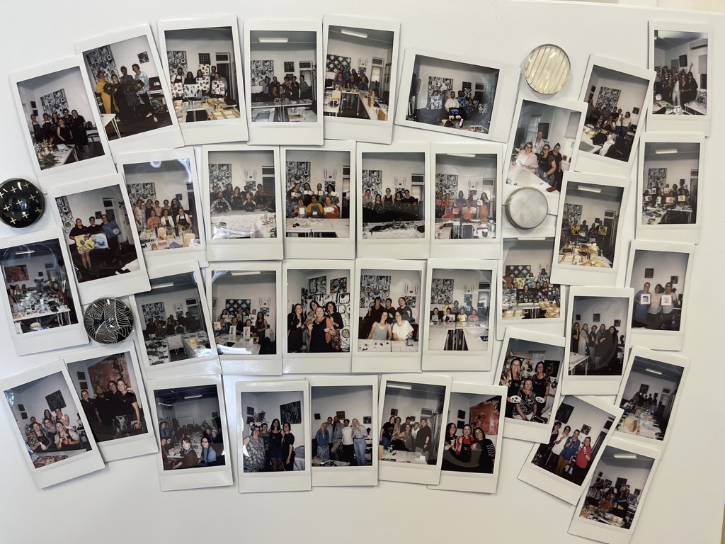 A polaroid wall recording past sessions held in the studio